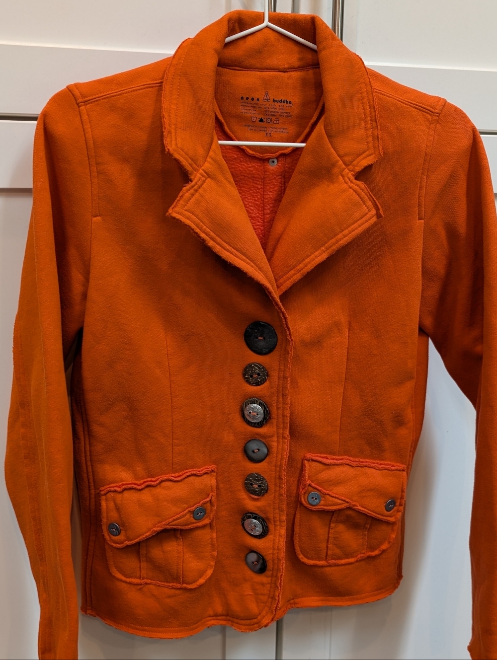 Neon Buddha orange jacket